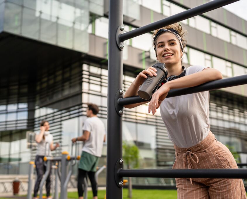 Person taking break after workout with supplement drink