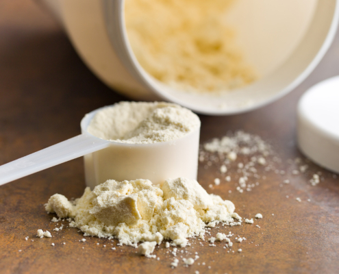 Side view of protein powder in a scooper