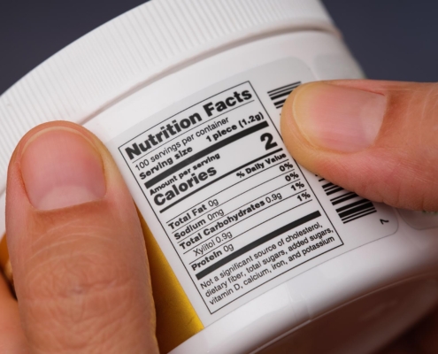 Person looking at supplement label